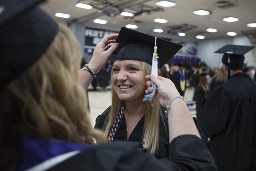 A student at graduation in their cap and gown.