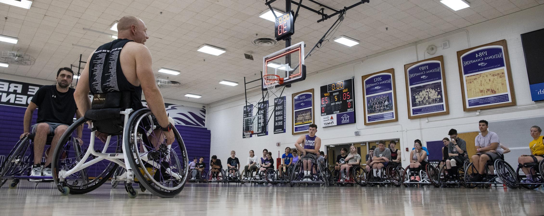 Opie Lade coaches wheelchair basketball.