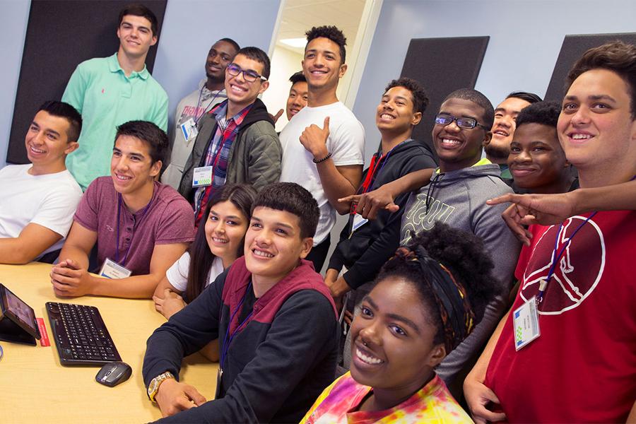 A large group pf students pose together for a photo.