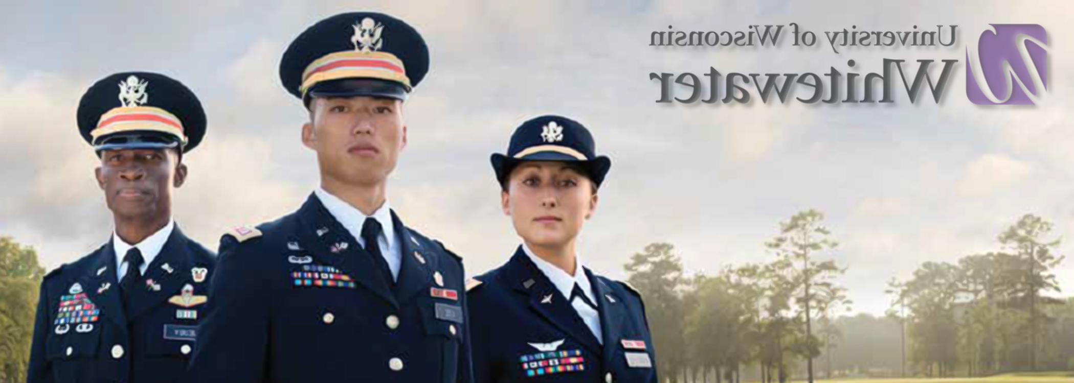 Three officers in uniform standing at attention