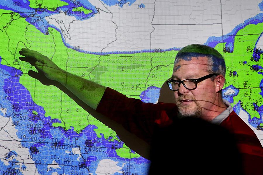 John Frye stands in front of a forecast map.