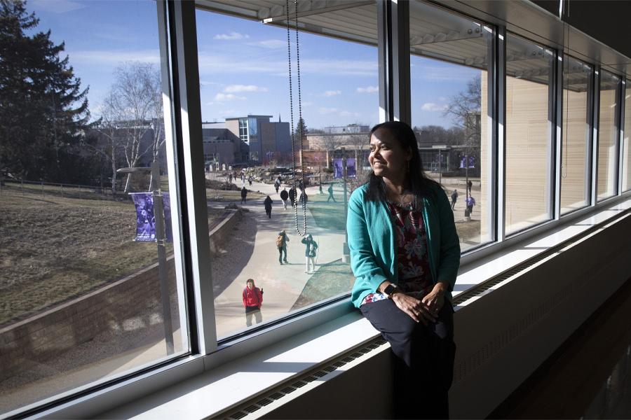 Rashiqa Kamal looks out onto campus from one of her classrooms in Hyland Hall..