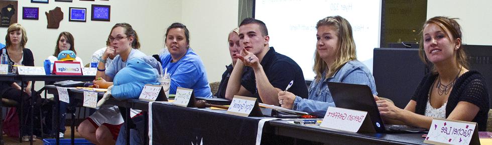 RHA members sitting at a desk