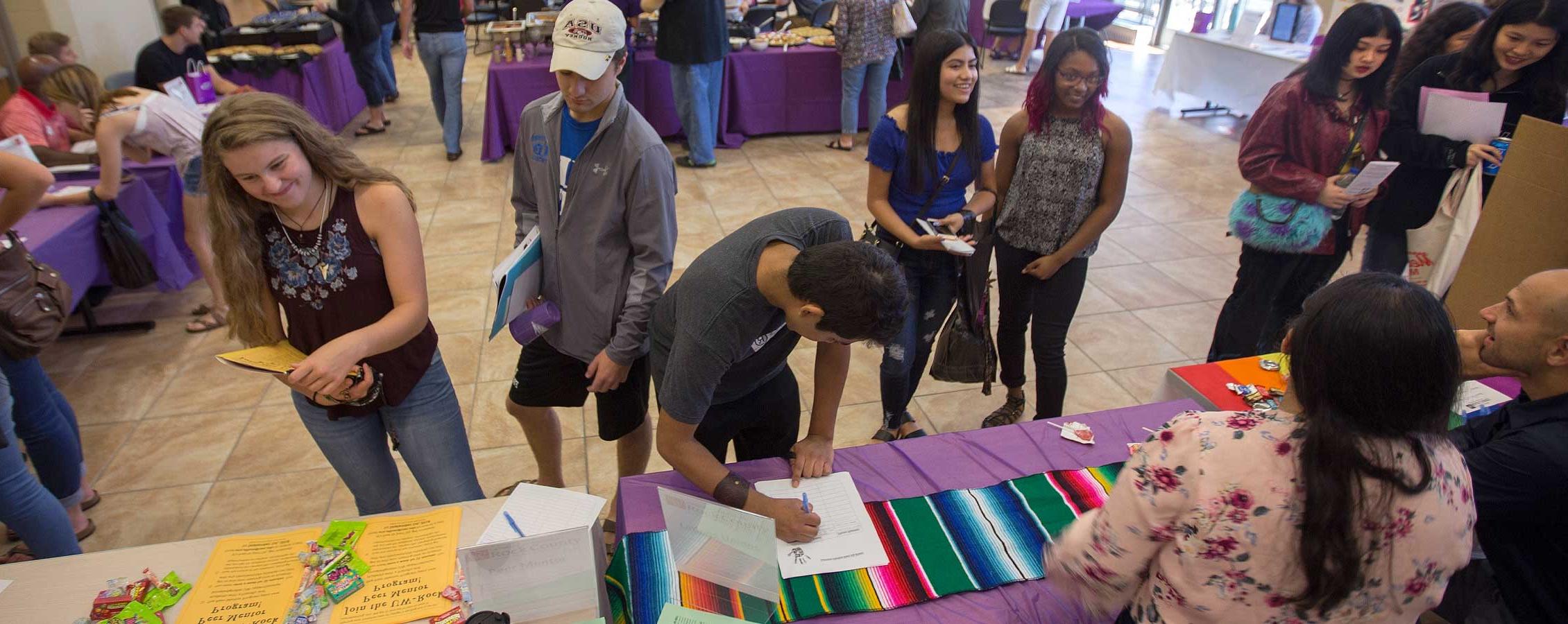 people attending a fair at UW-Rock County